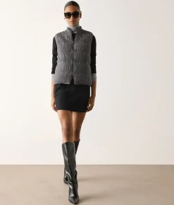 Piumino smanicato reversibile a coste intrecciate in cashmere